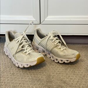 On Running Cream and Tan Sneakers